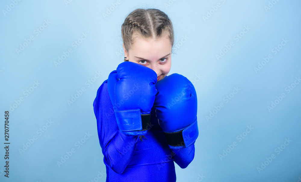 Girl cute boxer on blue background. With great power comes great