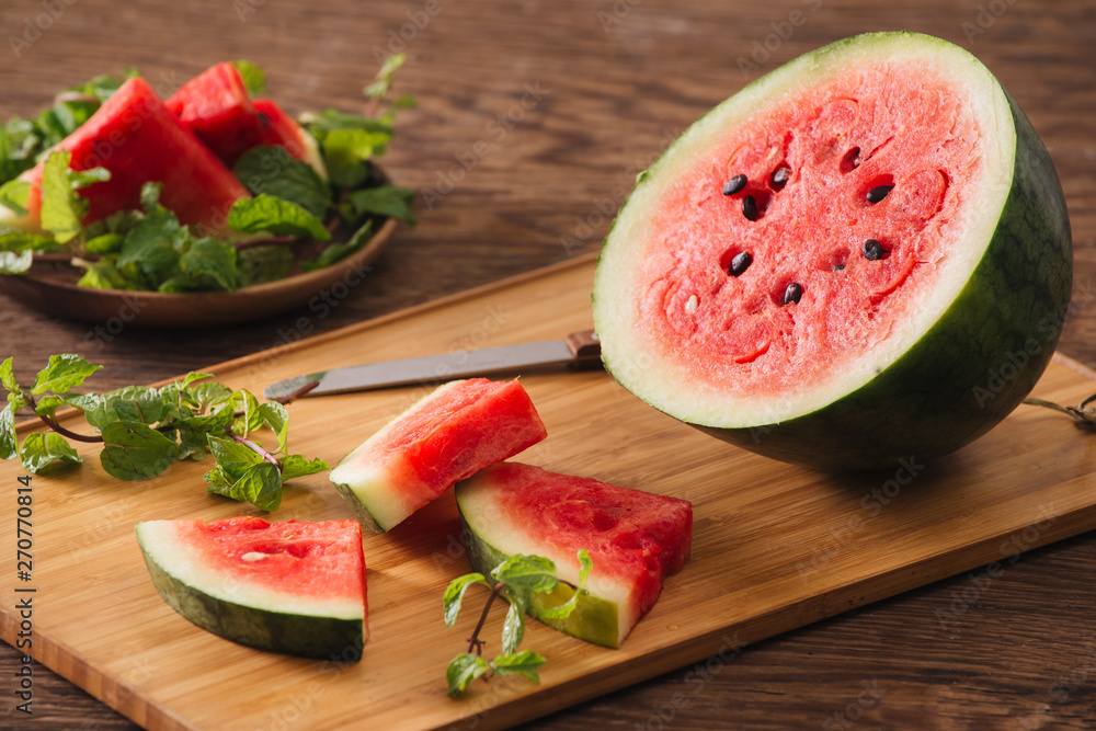 Sliced watermelon on the wood background Sliced watermelon on the wood background