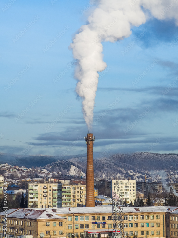 Air pollution by smoke coming out of factory chimney in the city. smoking chimney of a coal power plant. Air pollution by smoke coming out of factory chimney in the city. smoking chimney of a coal power plant.