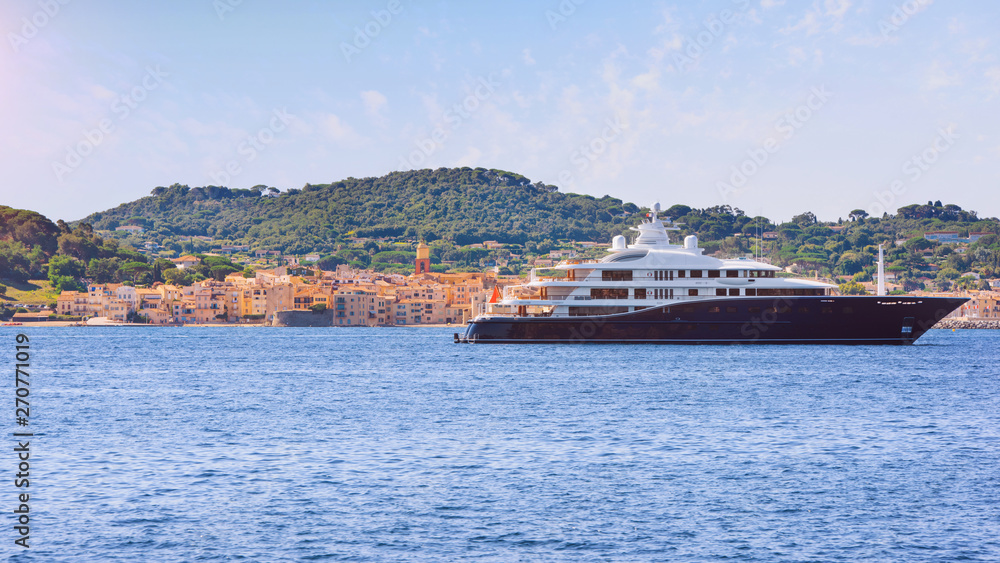 View to saint-tropez city from sea with luxury yacht