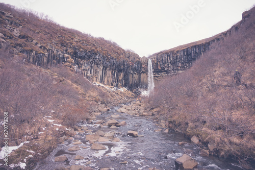 Beautiful famous waterfall in Iceland, winter season . ( Filtered image processed vintage effect. )