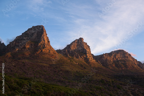 Sunset on a few of the twelve apostles seen from Chapman’s Peak Drive near Cape Town, South Africa © nielsvos