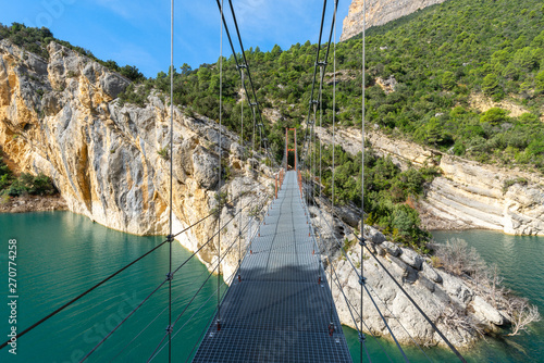 Suspension bridge at Congost de Mont-Rebei defile, border between Catalonia and Aragon, Spain photo