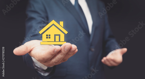 Home insurance, real estate agent in suit