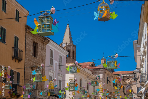 Charming narrow coblestoned streets in the old city center of Alghero (L'Alguer) , Sardinia, Italy. photo