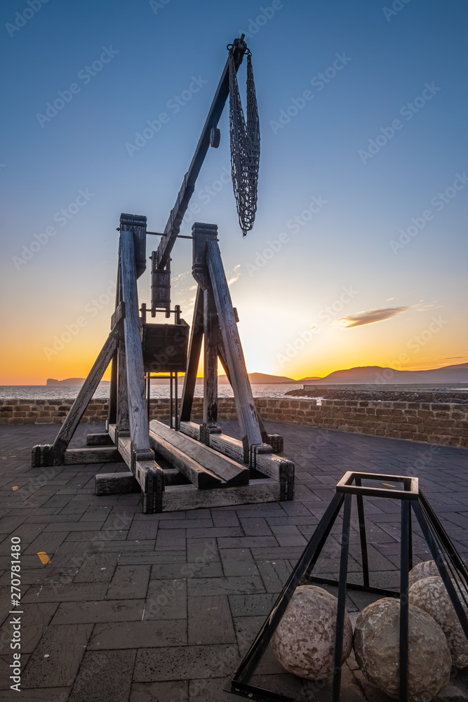 Dramatic sunset over the sea front in Alghero (L'Alguer), province of Sassari , Sardinia, Italy. Dramatic sunset over the sea front in Alghero (L'Alguer), province of Sassari , Sardinia, Italy.