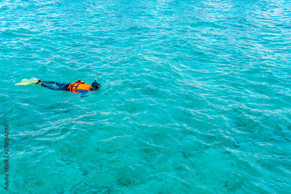 Snorkeling in tropical Maldives island .