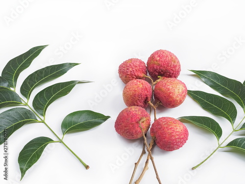 Delicious red ripe Lychees fruit with green leaves isolated on white background.