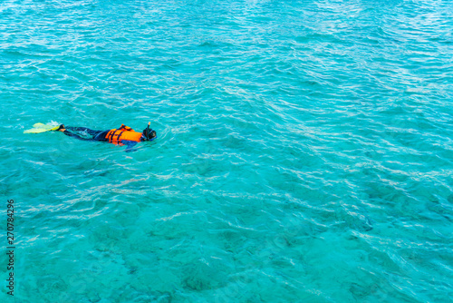 Snorkeling in tropical Maldives island . © jannoon028