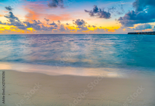 Fototapeta Naklejka Na Ścianę i Meble -  Beautiful water villas in tropical Maldives island at the sunset time .