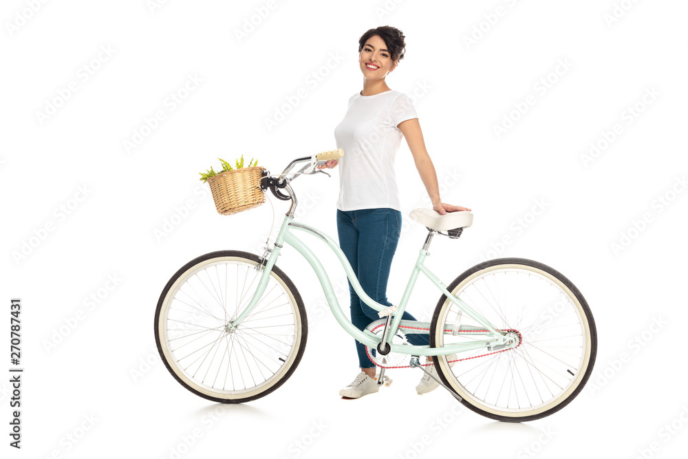 cheerful latin woman standing with bicycle isolated on white cheerful latin woman standing with bicycle isolated on white