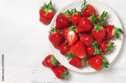 Wallpaper Mural Fresh strawberries in plate on white wood Torontodigital.ca