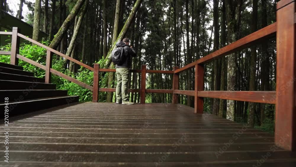 Young Caucasian Male Photographer Visit Alishan Scenic Area Taking Pictures of Forest with Mist, Haze and Fog in Taiwan Young Caucasian Male Photographer Visit Alishan Scenic Area Taking Pictures of Forest with Mist, Haze and Fog in Taiwan