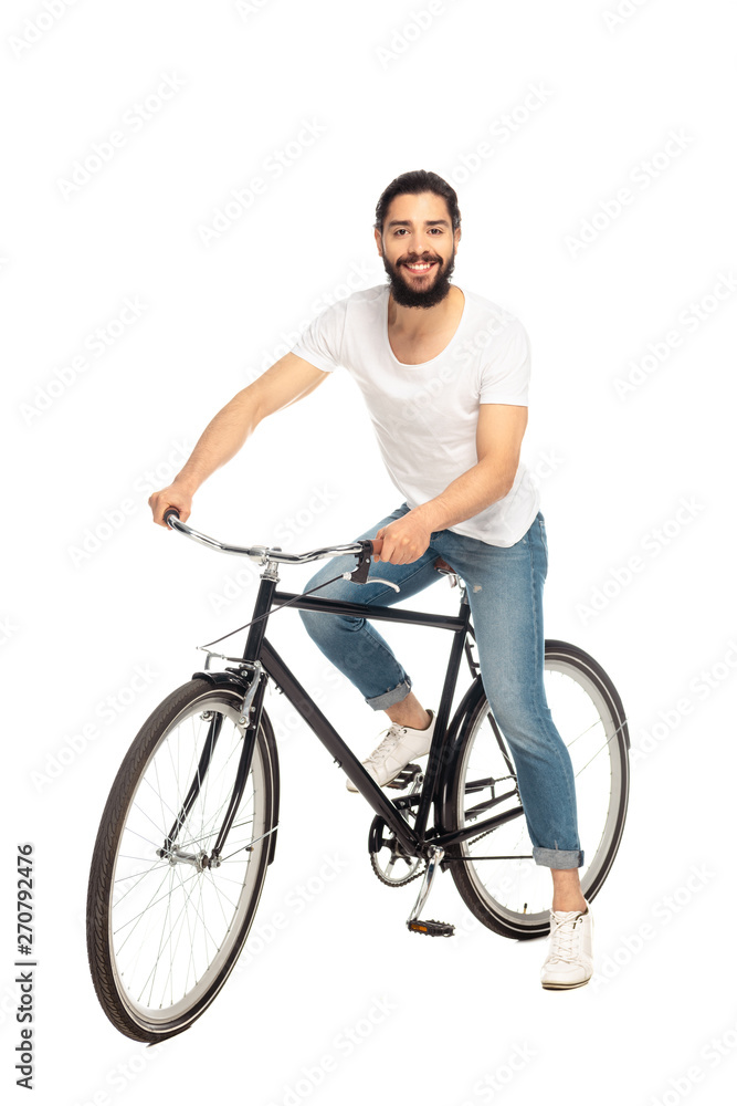 cheerful latin man riding bicycle isolated on white cheerful latin man riding bicycle isolated on white