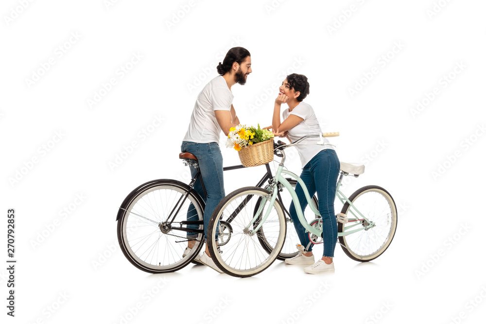 bearded latin man looking at attractive woman sitting on bicycle isolated on white bearded latin man looking at attractive woman sitting on bicycle isolated on white