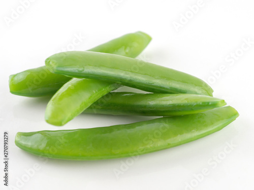 Closeup green peas fresh vegetable on white background, sugar snap pea