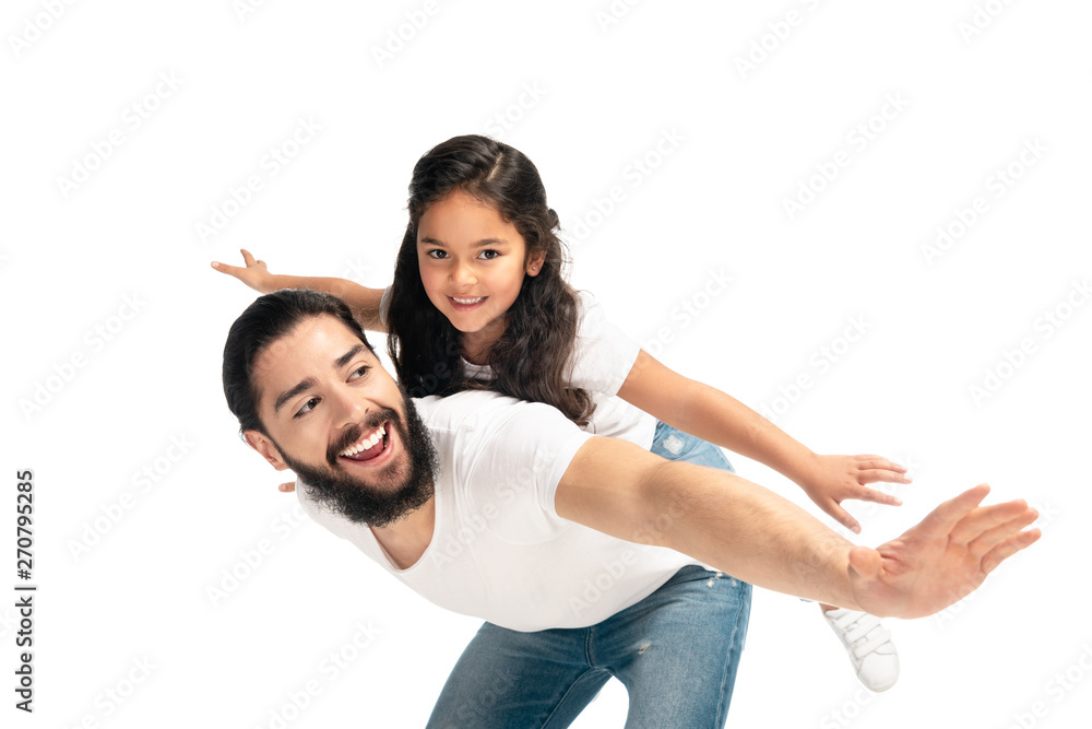 happy latin father carrying on back cute daughter with outstretched hands isolated on white happy latin father carrying on back cute daughter with outstretched hands isolated on white