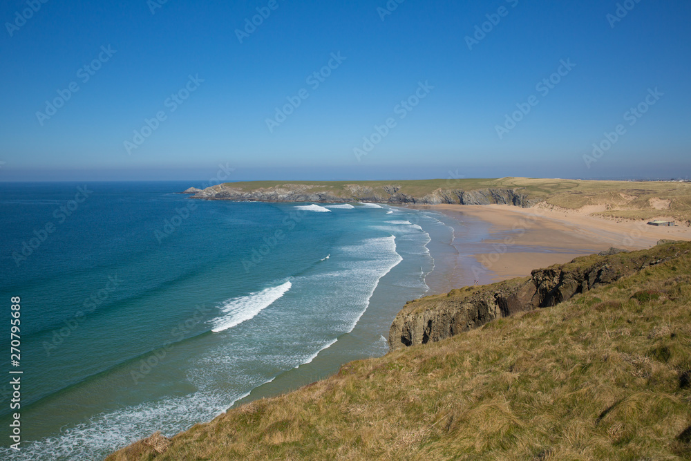 Holywell Bay Cornwall with waves beach and Cornish coast on a beautiful day Holywell Bay Cornwall with waves beach and Cornish coast on a beautiful day