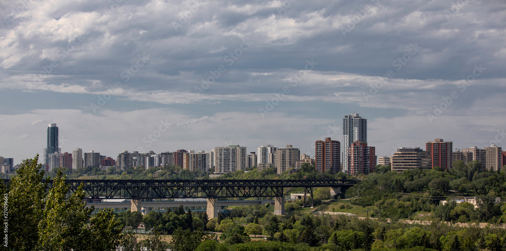 Edmonton, Alberta, Canada -Bridges and Several Skyscrapers of Edmonton downtown at sunset on a cloudy day