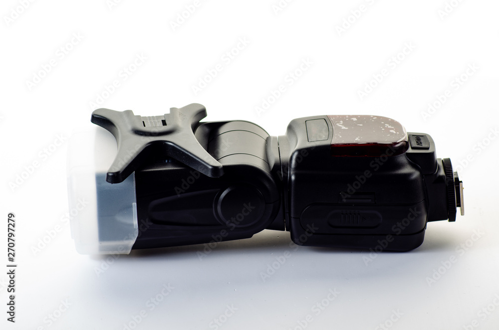 The camera flash is isolated on a white background The camera flash is isolated on a white background