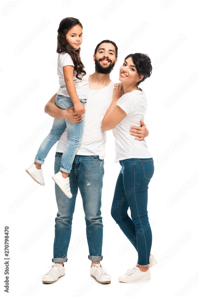 happy latin man holding in arms cute daughter while standing with wife isolated on white happy latin man holding in arms cute daughter while standing with wife isolated on white
