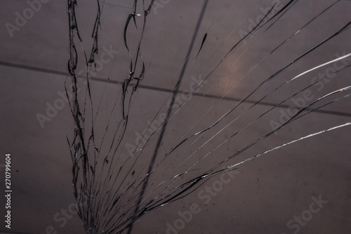 long cracks on broken glass close up. texture  background  wallpaper