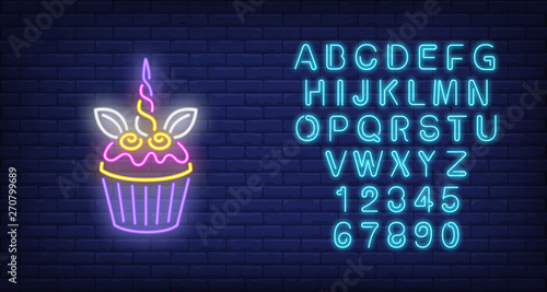 Unicorn cake neon sign. Glowing neon cake with unicorn horn on dark blue brick background. Vector illustration can be used for celebrations, cake shops, event organization