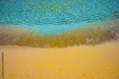 Fototapeta Naklejka Na Ścianę i Meble -  Soft wave of turquoise sea water on the sandy beach