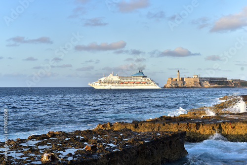 Cruiseship leaving Havana Harbor passing Morro Castle and lighthouse Cuba