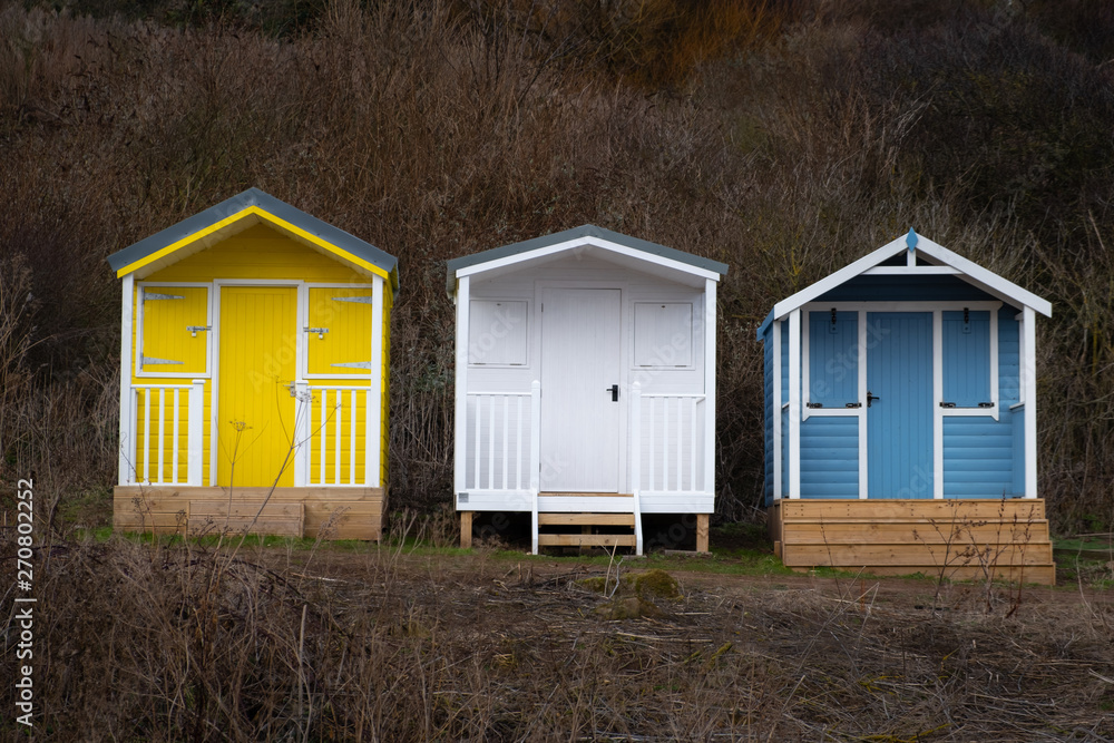 Three Beach Huts in Winter