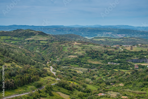 The village of Osilo, overlooking the fertile Anglona hills sloping down to the sea, province of Sassari , Sardinia, Italy.