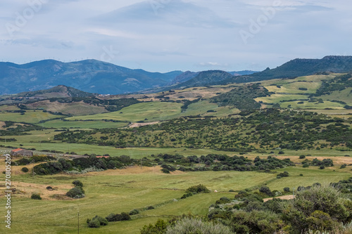 The village of Osilo, overlooking the fertile Anglona hills sloping down to the sea, province of Sassari , Sardinia, Italy.