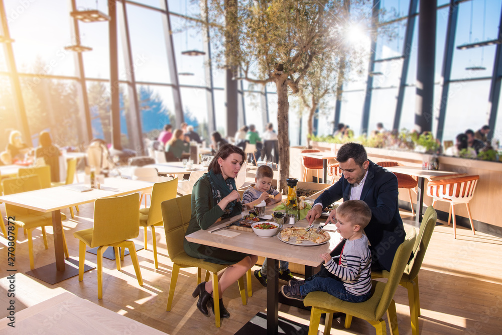 happy family enjoying lunch time together happy family enjoying lunch time together