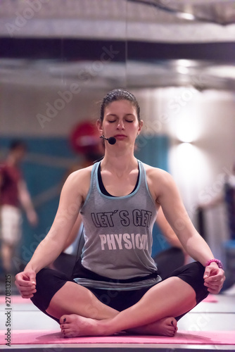 sportswoman doing yoga exercise and meditating