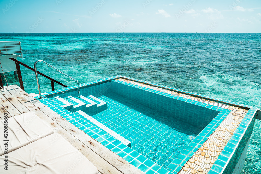 swimming pool with sea background in Maldives