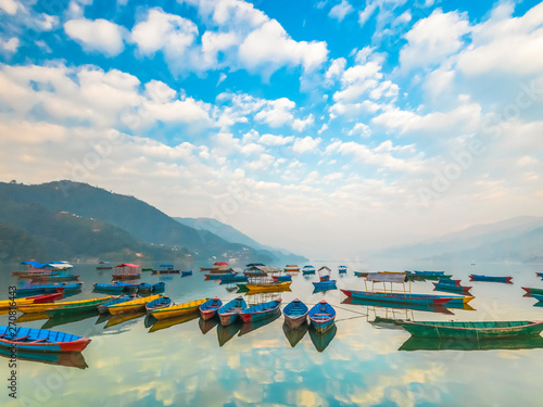 The Boats with different colors,the Sky reflection in the water.