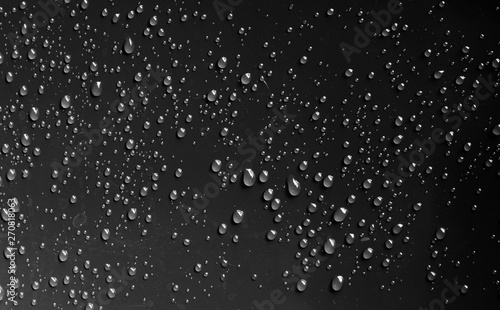 water drop on black plastic texture