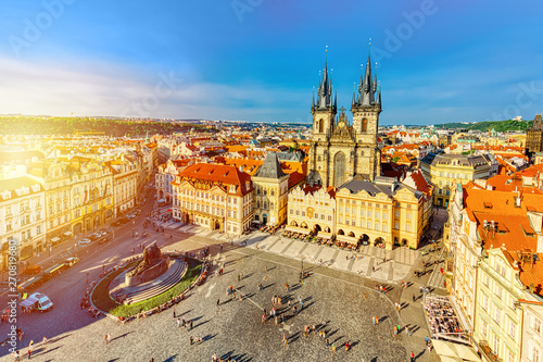 Photography Buildings on the Old Town square Staromestska Namesti with Tyn Church in Prague, Czech Republic during summer sunny day sunset with blue sky