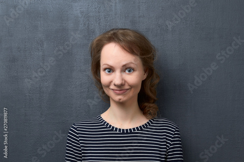 Studio portrait of happy smiling girl © Andrei Korzhyts