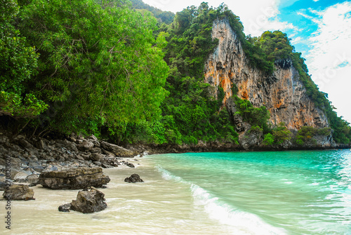 Monkey beach, with crystal clear waters in emerald color, Ko Phi Phi island, Phuket, Thailand