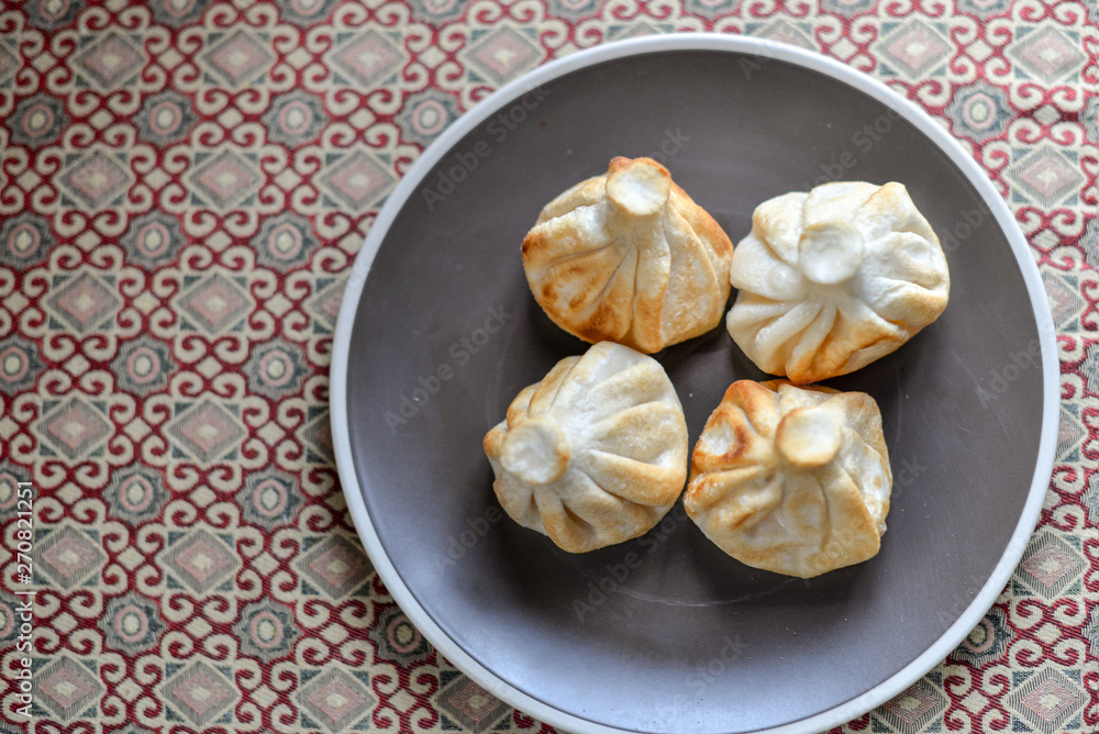 fried khinkali on a plate top view fried khinkali on a plate top view