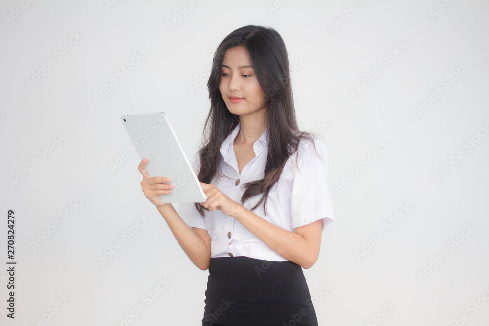Portrait of thai adult student university uniform beautiful girl using her tablet. Portrait of thai adult student university uniform beautiful girl using her tablet.