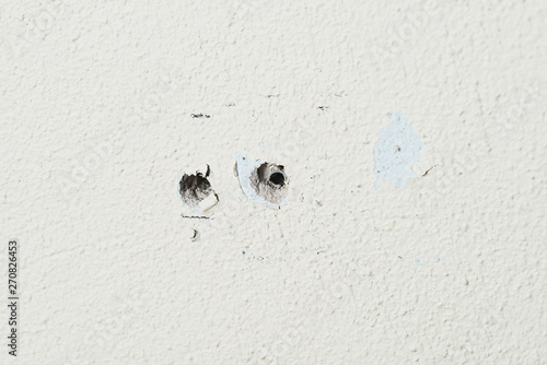 Two holes in the wall foam or aerated concrete for the installation of dowels for bolts.