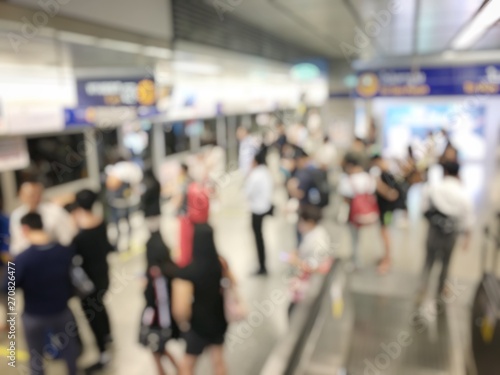 blurred image of Crowded station with people and passenger standing, walking and waiting for pick and choose the best public transport during rush hour in Bangkok city. © narin_nonthamand