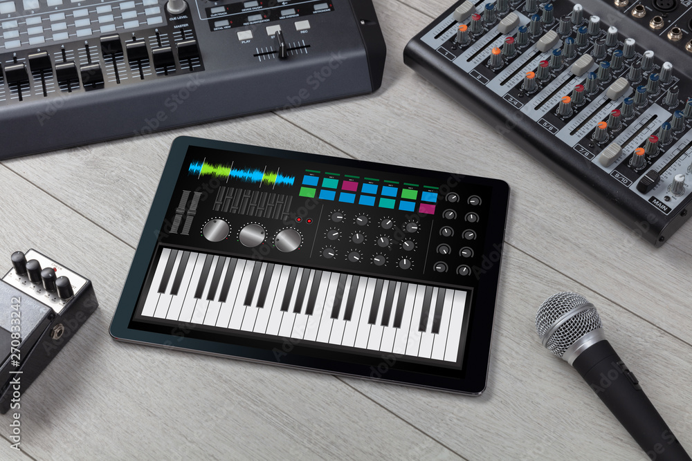 Piano synthesizer app on tablet and musical instrument concept
Piano synthesizer app on tablet and musical instrument concept
