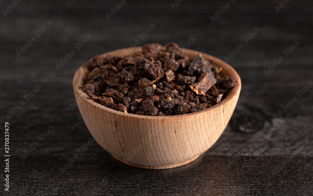 Bowl of Myrrh on a Dark Wood Table Bowl of Myrrh on a Dark Wood Table