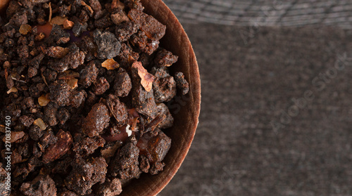 Fotografija Bowl of Myrrh on a Dark Wood Table