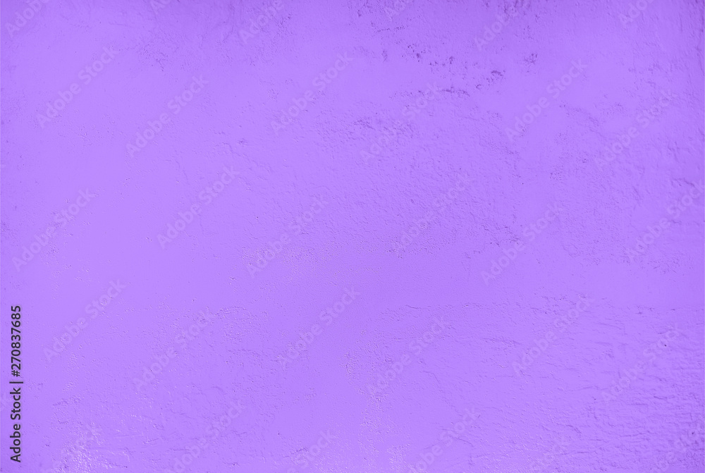 Fototapeta premium Textured relief plastered painted wall purple colour