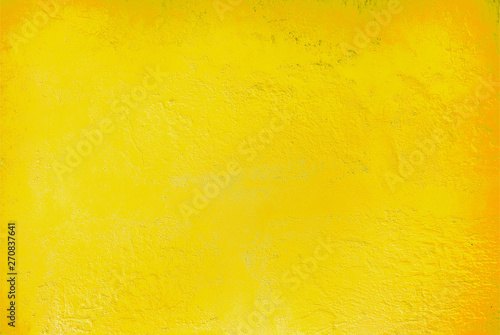 Textured relief plastered painted wall bright lemon yellow color