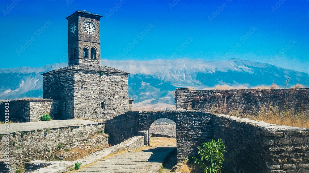 clock tower on top of the fortress in Gjirokastra, Albania, beautiful cityscape.